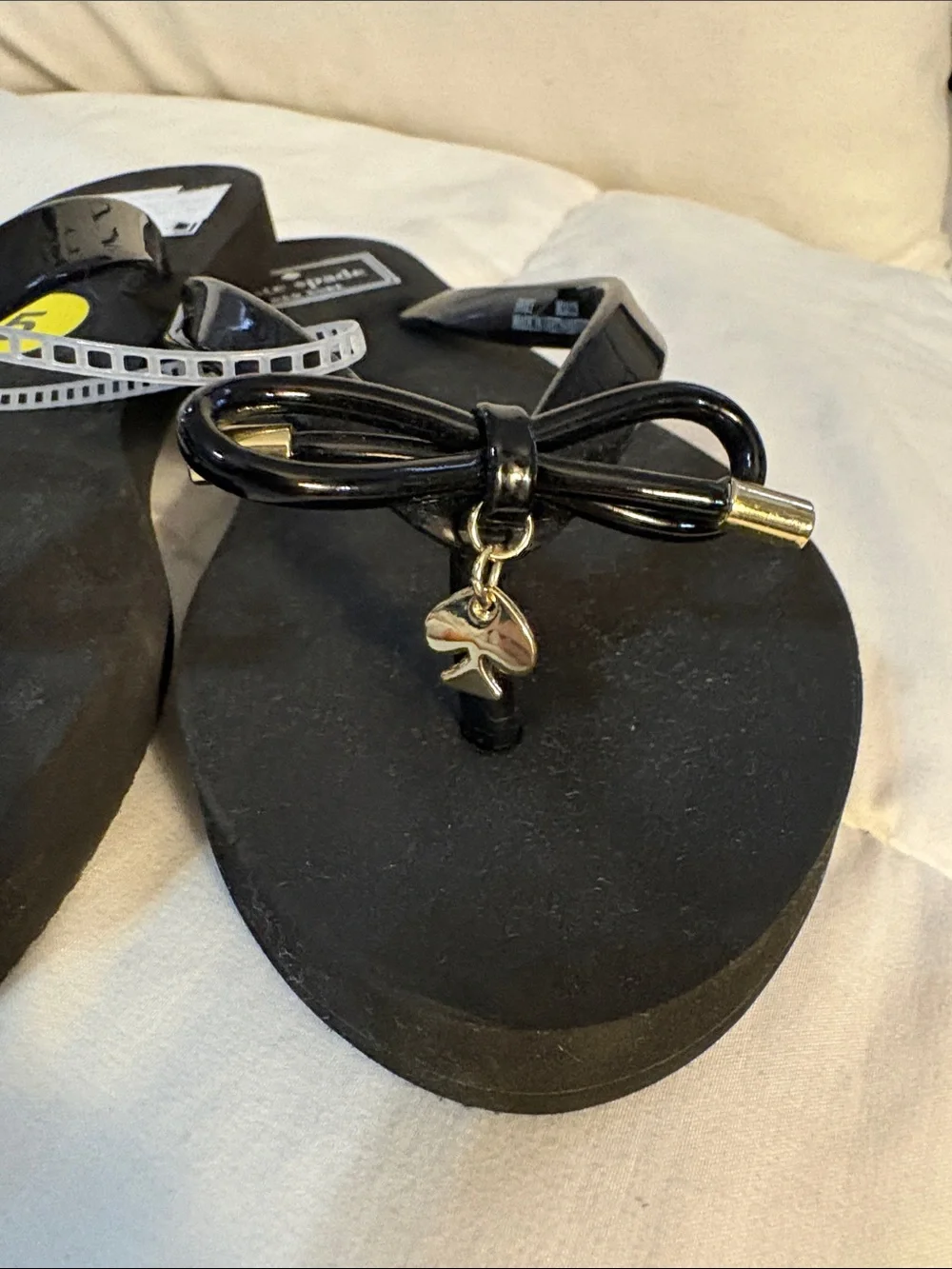 kate spade Black Bow Jelly Flip Flops with Gold Accents
